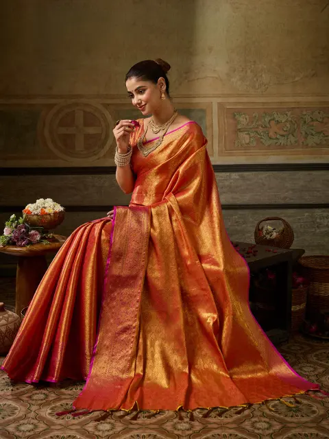 Orange Kanchivaram Silk Saree with Pink Border