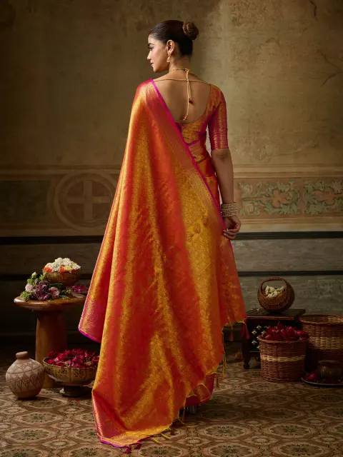 Orange Kanchivaram Silk Saree with Pink Border