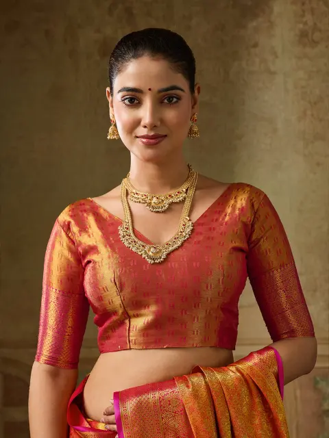 Orange Kanchivaram Silk Saree with Pink Border